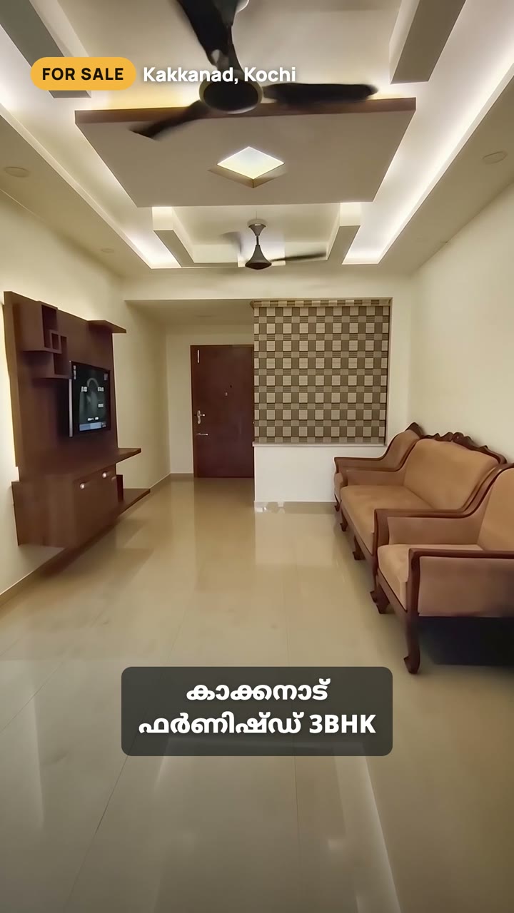 A frame from a sample reel: living room with a Malayalam caption reading Kakkanad, furnished 3BHK